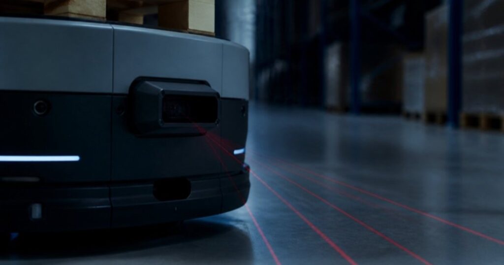 Lidar sensor on a warehouse robot projecting laser lines across the floor